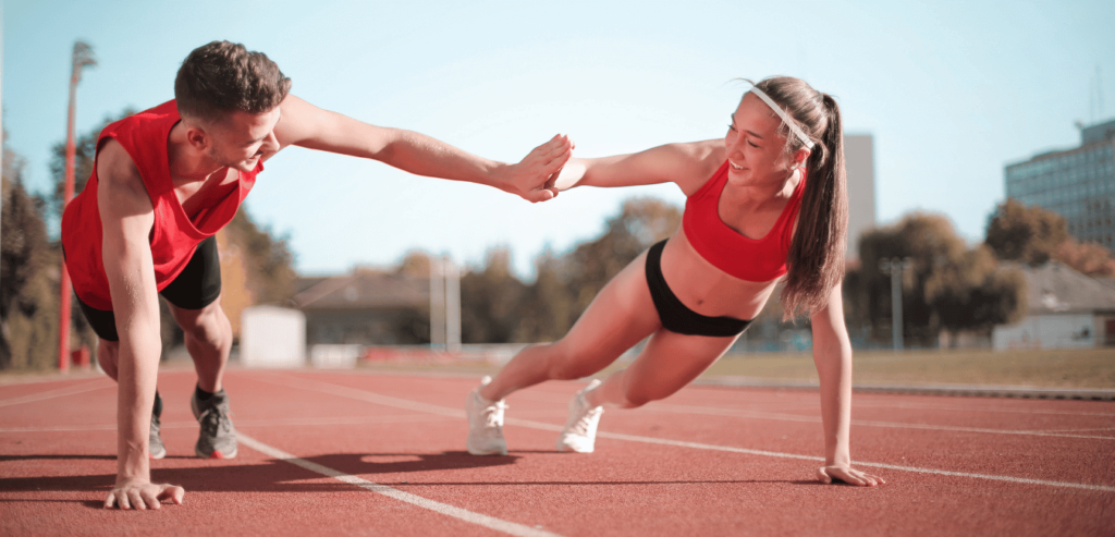 Negotiating NIL Deals Tips for Student-Athletes Ostrich App Cover Image of a male and female runner planking on a track and high fiving